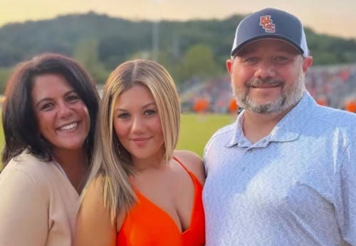 Helen Demstihas outside with daughter and husband.