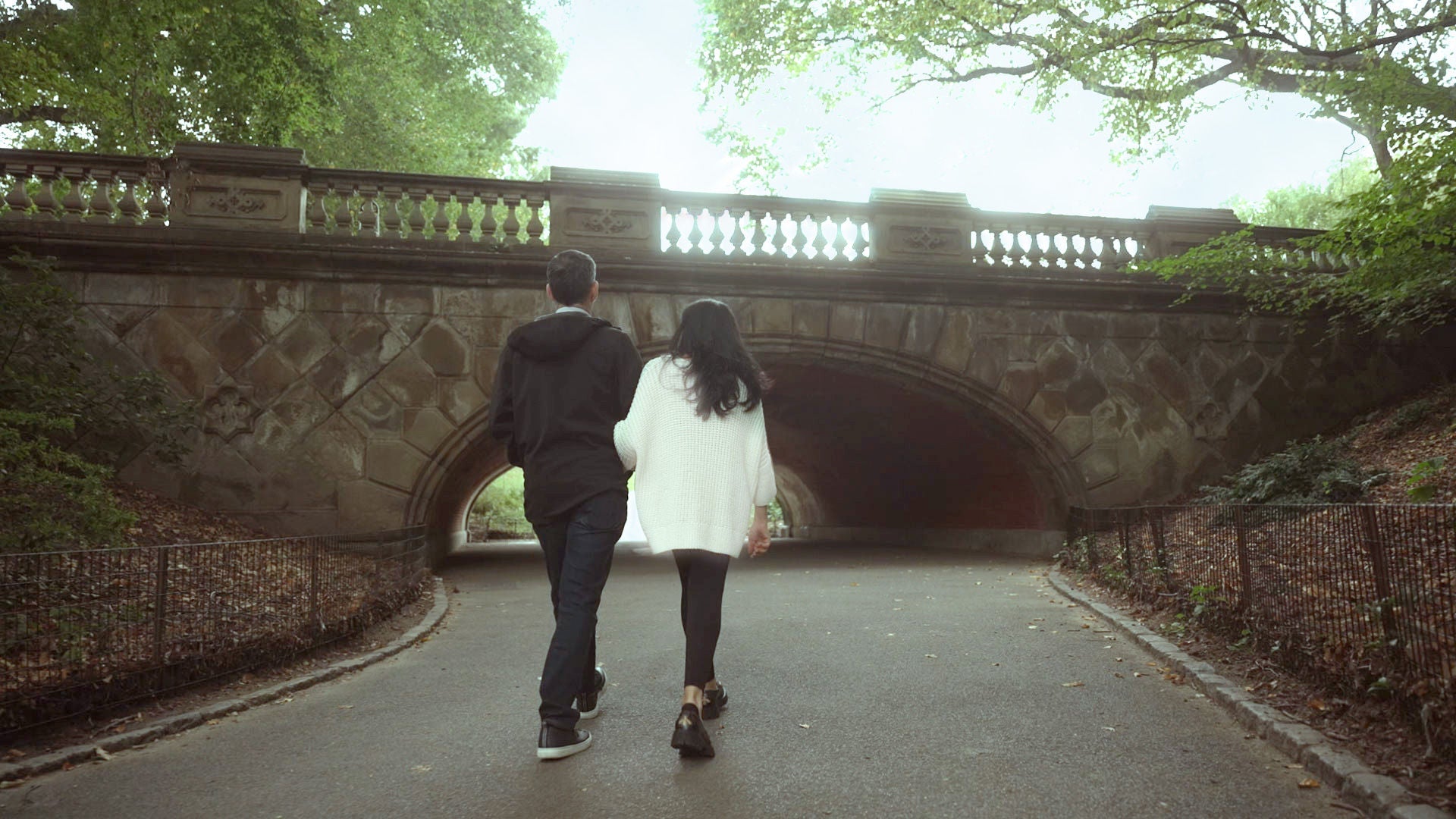 Person walking on a wooded path.